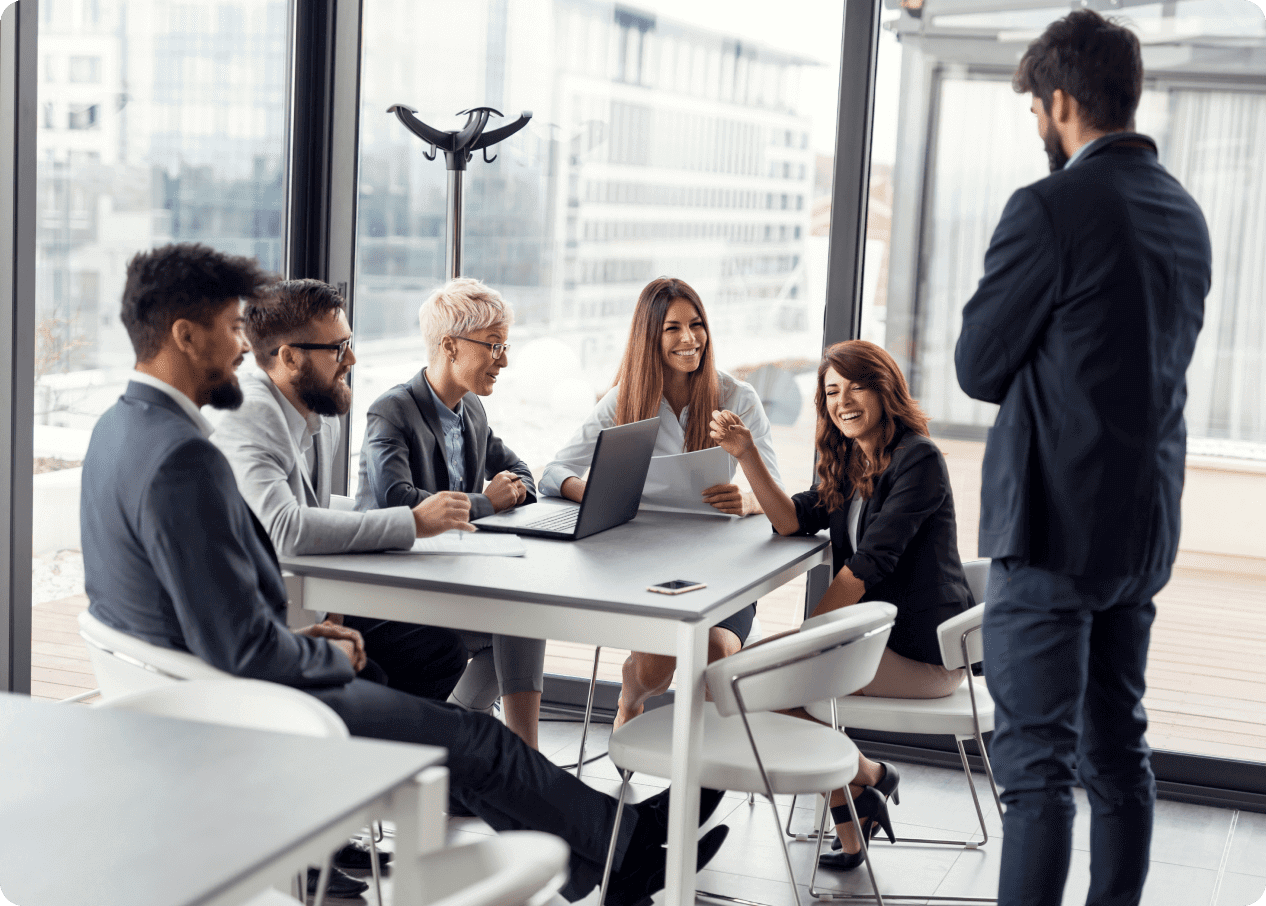 Business meeting with people around a table.